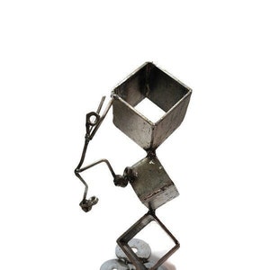 Reaching new heights, Welded metalworks climber sculpture, free climb, handmade scrap metal art