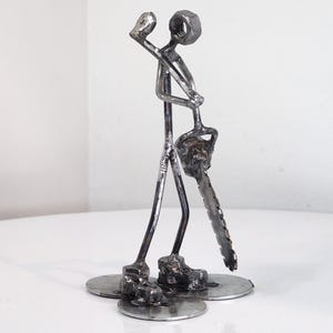 Welded metal lumberjack sculpture
