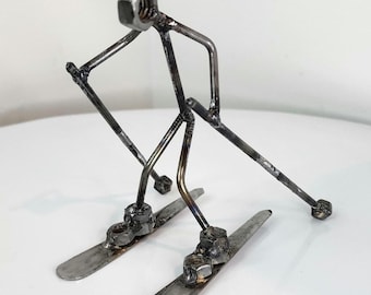 Welded metal art skiing sculpture