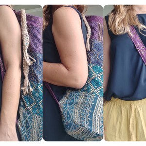 May include: A multi-coloured patchwork tote bag with a long, knotted strap. The bag is made of different fabrics with geometric patterns in shades of blue, purple, and gold.