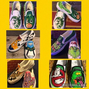 May include: A collection of custom-painted Vans slip-on shoes. Designs include cartoon characters such as a gecko, a character from PJ Masks, Woody and Buzz Lightyear, the Grinch, and Ghostbusters. Each shoe features unique artwork.