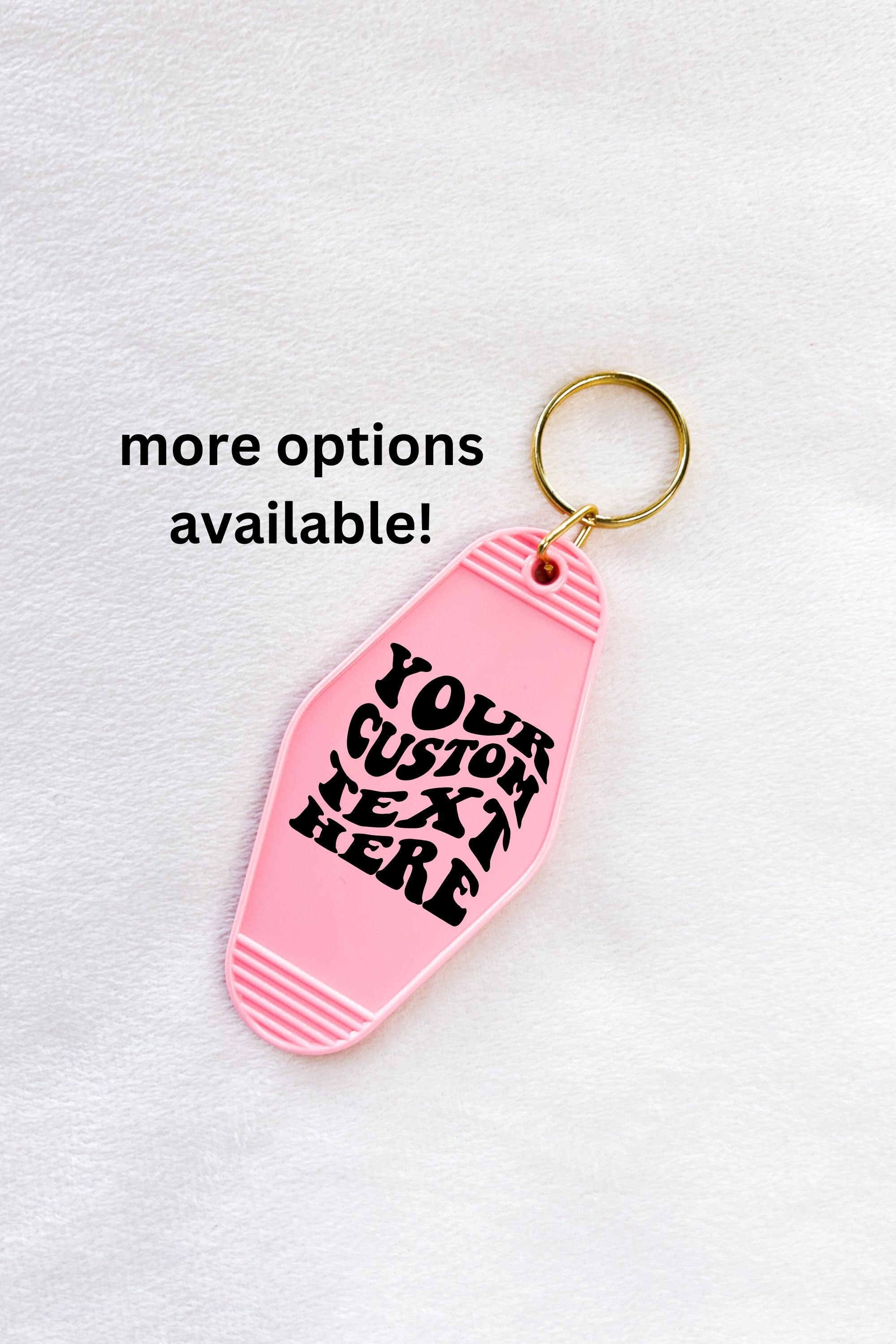 black or white custom motel keychain with gold lettering