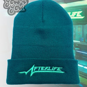 May include: A teal blue beanie with a green embroidered logo that says "AFTERLIFE".