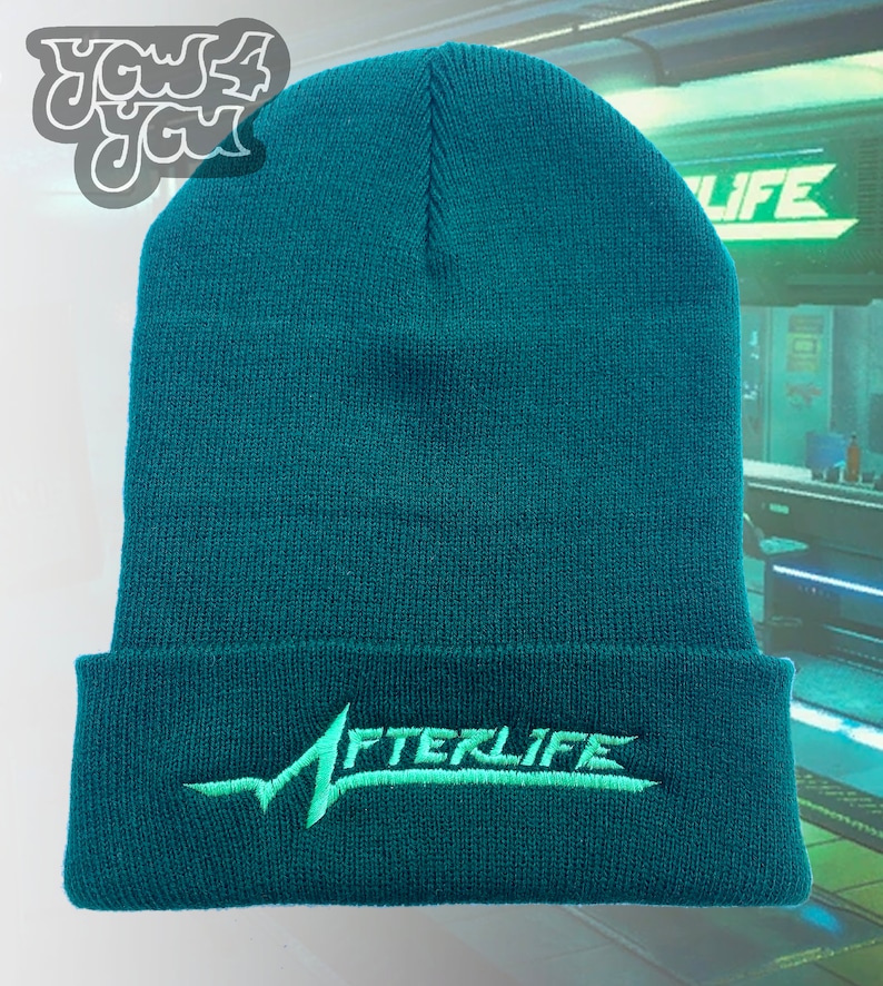 May include: A teal blue beanie with a green embroidered logo that says "AFTERLIFE".