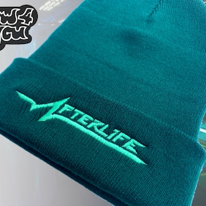 May include: A teal blue beanie with a light green embroidered logo that says "AFTERLIFE".