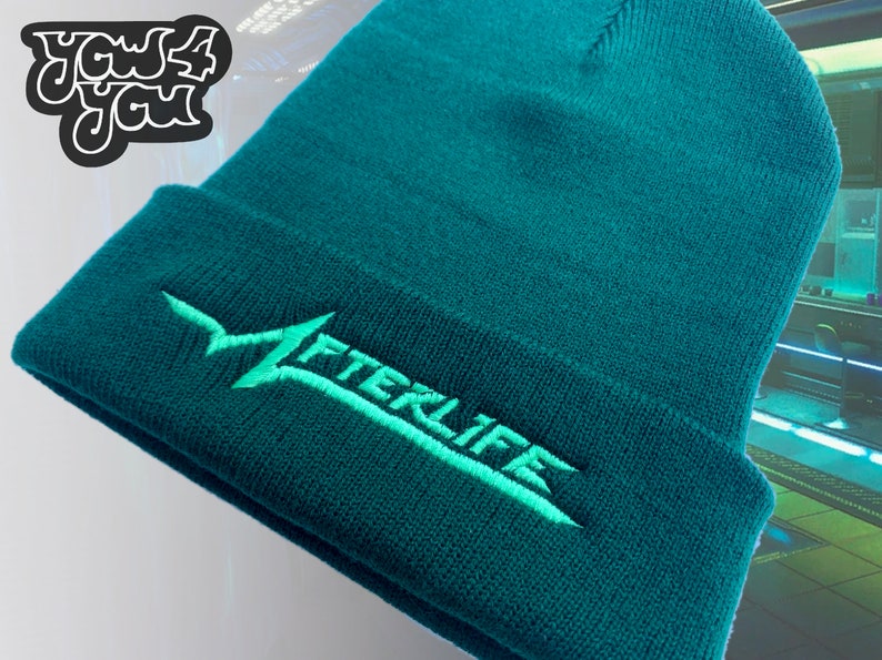 May include: A teal blue beanie with a light green embroidered logo that says "AFTERLIFE".