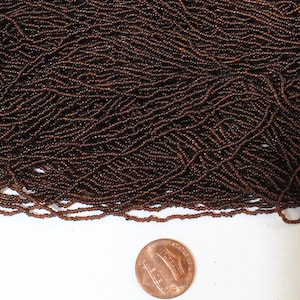RARE Antique Micro Seed Beads- 17/0 Transparent Dark Warm Brown with a few Orange Beads- 3.8 gram Hanks