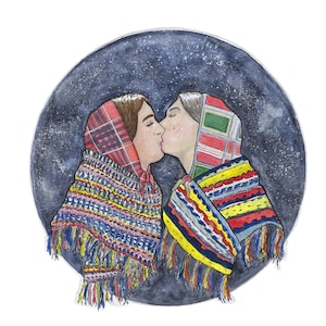 May include: Watercolour illustration of two people kissing, framed by a dark blue circle. They wear colourful shawls with fringe and headscarves. The image is signed "Tadhg Ó Ciardha 2021".