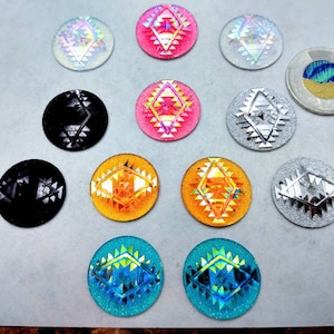 May include: Assortment of 12 decorative round stickers with various geometric patterns and iridescent finishes. The stickers feature a variety of colours including pink, blue, silver, gold, and black.