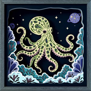 May include: A layered paper art piece featuring an octopus in a space-themed design. The octopus is light green with pink accents, set against a dark blue background with stars and a planet. The artwork is framed in a gray wooden frame. The text "SVG", "DXF", "EPS", and "PDF" are visible.