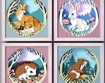 Op de afbeelding: Vier ingelijste papieren uitsnijdingen met een vos, een konijn, een egel en een bever in een bosrijke omgeving. Elk ontwerp is in een ronde lijst met een lichtblauwe achtergrond en een witte rand.