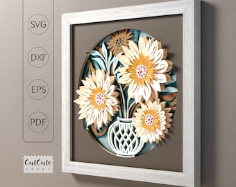 May include: A framed papercraft artwork featuring a bouquet of yellow and white flowers in a vase. The flowers are layered and have a 3D effect. The artwork is set against a brown background.