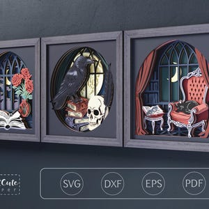 May include: Three framed layered paper art pieces featuring gothic scenes. The first shows a candle, roses, and an open book. The second displays a raven, a skull, and books. The third depicts a cat on a chair by a window. Text reads CutCute paper.