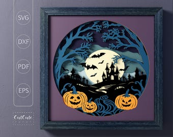 May include: A blue and purple paper cut-out design of a spooky Halloween scene with a castle, bats, a full moon, and three jack-o'-lanterns.