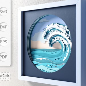 May include: A blue and white papercraft wave design in a white frame. The wave is layered and appears to be crashing. The background is a dark blue.