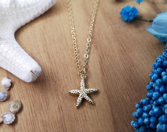 Fine chain jump necklace with golden starfish pendant in fine gold