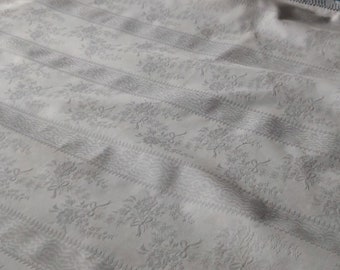 A vintage French lace edged counterpane or comforter cover in superb white cotton floral damask with moiré stripe