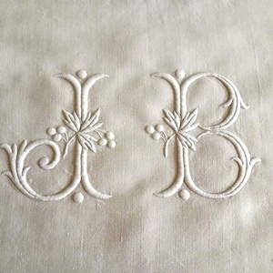 A wide antique French trousseau sheet in very heavy pure linen with large hand embroidered monogram JB and drawn threadwork border.  1900s