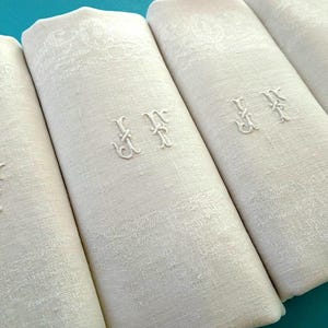 A set of 4 large antique French pure linen damask napkins with hand embroidered initials JF.  Heirloom linen, circa 1910s