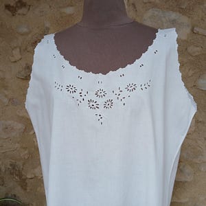 A vintage French night dress in pure white cotton, beautifully hand embroidered with flowers in open whitework and scalloped edges.  L
