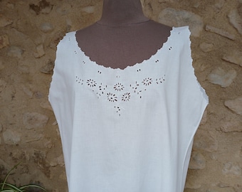 A vintage French night dress in pure white cotton, beautifully hand embroidered with flowers in open whitework and scalloped edges.  L