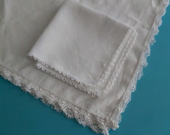 A vintage French pure linen white tablecloth edged with handmade lace, and two large doilies / serviettes