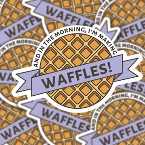 May include: A sticker with a cartoon waffle and the text "And in the morning, I'm making waffles!" in a purple banner.