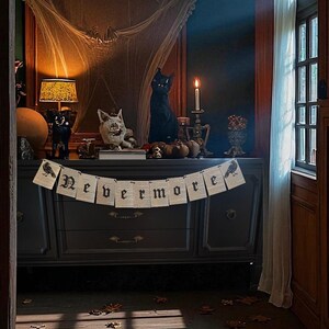 May include: A dark, gothic-themed room decorated for Halloween. A banner reading "Nevermore" hangs over a dark gray dresser. Decorative items include black cat figurines, pumpkins, and a skull. A spiderweb decorates a large framed mirror.