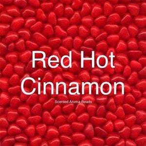 May include: Red heart-shaped scented aroma beads in a red cinnamon fragrance.