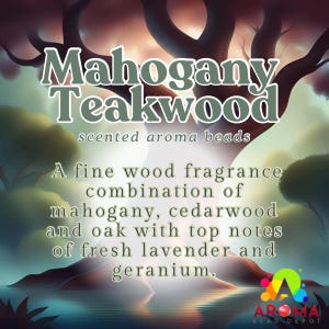 May include: A digital illustration of a forest scene with a large tree in the background. The text "Mahogany Teakwood scented aroma beads" is displayed above the tree. The text below the tree reads "A fine wood fragrance combination of mahogany, cedarwood and oak with top notes of fresh lavender and geranium."