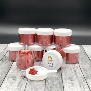 May include: Multiple small jars of red mica powder, labeled "Ruby Red" with the brand name "Aroma Food Colors".