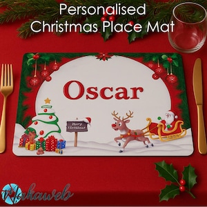 May include: Personalised Christmas place mat with the name "Oscar" in red. The mat features a Christmas tree, Santa in a sleigh, and a reindeer. The border is red and green with Christmas baubles.