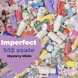 May include: A collection of miniature, imperfect 1:12 scale Mystery Minis in various colors, including white, pink, purple, yellow, and red. The image includes small bottles, cups, and containers. Text on a purple heart shape reads "Imperfect 1:12 scale Mystery Minis."