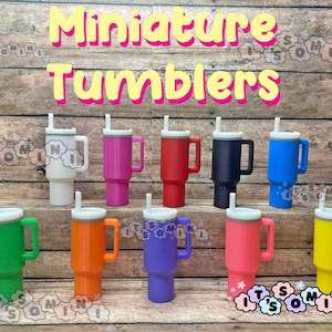 May include: A collection of miniature tumblers in various colors, including white, pink, red, navy, blue, green, orange, purple, and yellow. Each tumbler has a white lid and straw, with a handle on the side. The text "Miniature Tumblers" is displayed at the top.