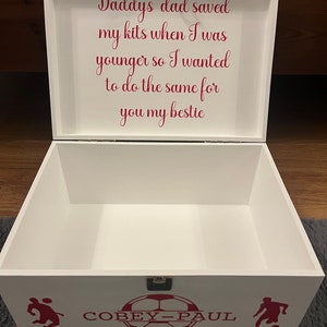 May include: White wooden box with a red inscription that reads "Daddy's dad saved my kits when I was younger so I wanted to do the same for you my bestie". The box has a red soccer ball design with the name "COBEY-PAUL" written on it.
