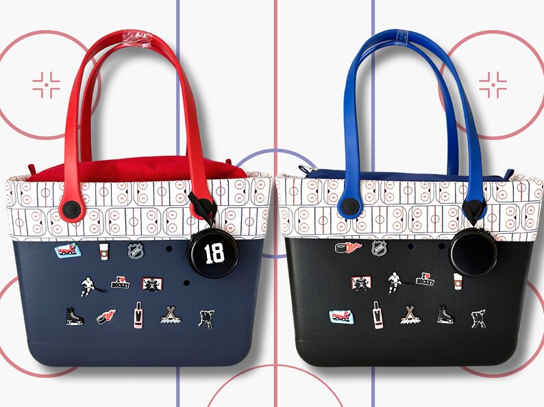 May include: Two black and white patterned tote bags with red and blue handles. The bags have a variety of hockey-themed charms attached to them. One bag has a black charm with the number 18 on it.