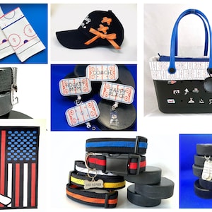 May include: A collection of hockey-themed crafts and accessories, including a black and white hockey rink patterned tote bag, a black baseball cap with an orange ribbon, a hockey puck keychain with the text "Hockey Mom", a black and white American flag with a hockey stick and puck, a black and white hockey puck necklace, and a stack of black hockey pucks with a silver chain and a hockey puck charm.