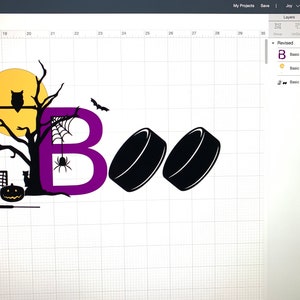 May include: A purple letter "B" with a spider and web hanging from it. A black silhouette of a tree with an owl perched on a branch. A yellow moon behind the tree. Two black hockey pucks. A black silhouette of a hockey net and a pumpkin. The text "Boo" is written in black.