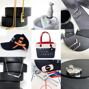 May include: A collection of hockey-themed accessories, including a gold necklace with a hockey skate pendant, a black baseball cap with orange accents, and a silver hockey stick necklace. Also featured are a tote bag, tie clips, and a ring.