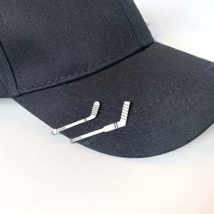 Hockey Stick and Goalie Stick Hat Brim Clip