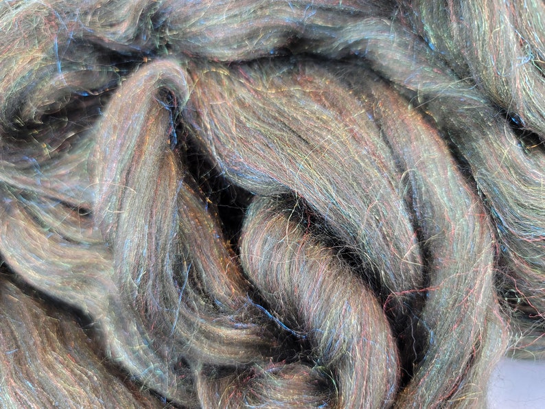 4 ounce dyed Merino and Rainbow Firestar combed toproving