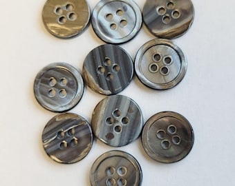 May include: Ten round, grey and brown, four-hole buttons. The buttons have a mottled, marbled appearance.