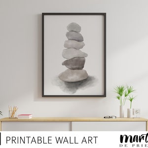 May include: A watercolor painting of a stack of gray stones, with a light gray background. The stones are stacked in a pyramid shape, with the largest stone at the bottom and the smallest stone at the top.