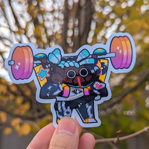 May include: A colorful sticker of a cartoon character lifting a pink and orange barbell. The character has black eyes, a black nose, and a pink heart on its chest. The character is wearing a black and white outfit with a blue and white design on its head.