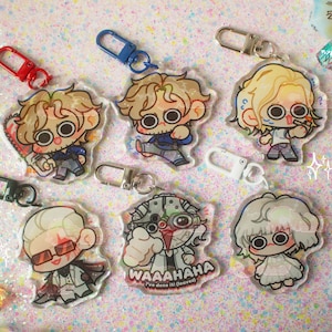 May include: Six acrylic keychains featuring chibi-style characters with large eyes. One character holds a chainsaw, another wears red glasses, and one has the text WAAAAHAHA I've done it! (oopsie) printed on it. Each keychain has a colorful plastic clasp.