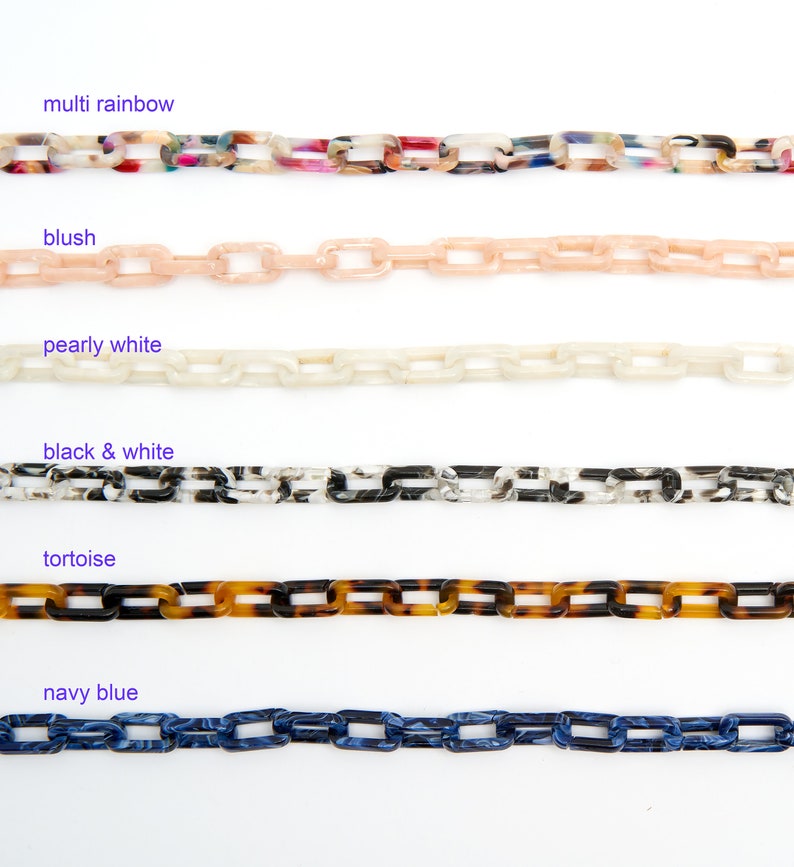 May include: Six different colours of plastic chain links, including multi rainbow, blush, pearly white, black and white, tortoise, and navy blue.
