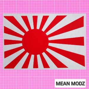 May include: A rectangular sticker with a red sunburst design, featuring a central red circle and alternating red and white rays. The text "MEAN MODZ" is in a white rectangle at the bottom.