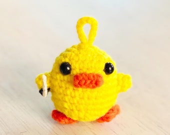 stuffed duck holding knife