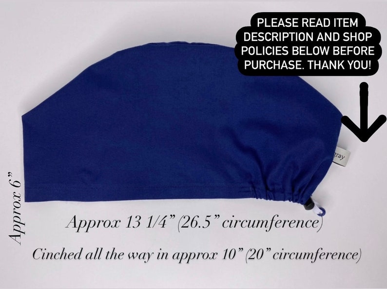 May include: A navy blue surgical scrub cap. The cap is approximately 6 inches high and 13 1/4 inches (26.5 cm circumference) around. The cinched circumference is approximately 10 inches (20 cm). The text on the image says "PLEASE READ ITEM DESCRIPTION AND SHOP POLICIES BELOW BEFORE PURCHASE. THANK YOU!"