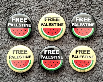 May include: Six round black and yellow buttons with the text "FREE PALESTINE" and a watermelon graphic.